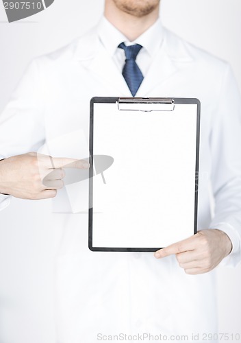 Image of doctor pointing at blank white paper