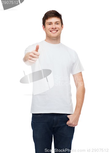 Image of smiling man in white t-shirt showing thumbs up