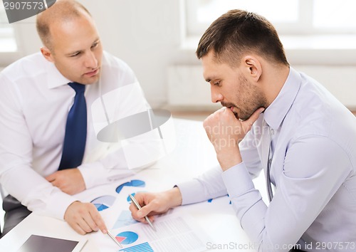 Image of two businessmen having discussion in office