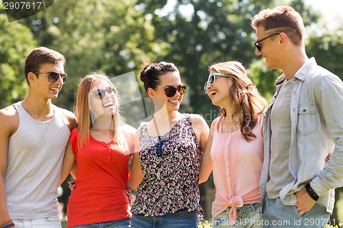 Image of group of smiling friends outdoors