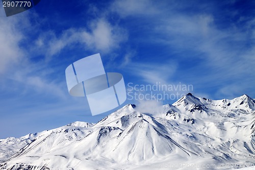 Image of Winter snowy mountains at windy day