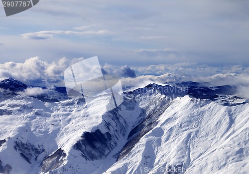 Image of Winter mountains in mist at windy day