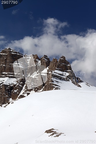 Image of Snowy rock and sky with clouds