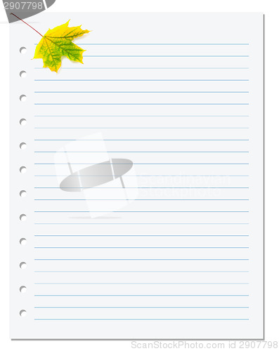 Image of Notebook paper with yellow autumn maple leaf on white