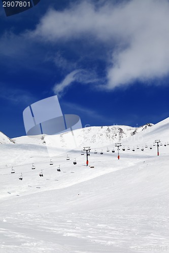 Image of Chair-lift and ski slope at sun day