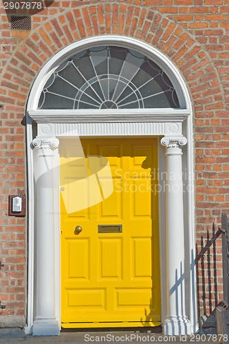 Image of Yellow Georgian door in Dublin Ireland