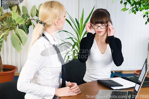 Image of Confident businesswoman work in office