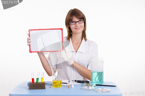 Image of Chemist holding a tablet