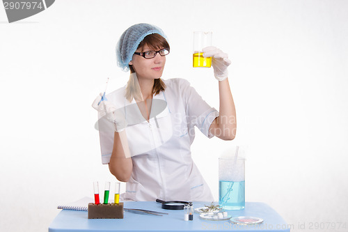 Image of Chemistry teacher considers the result of experience