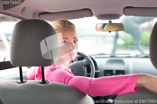 Image of Lady looking back while reversing.