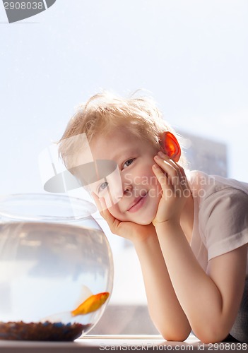 Image of kid and goldfish