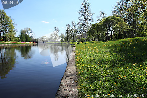 Image of river and green field