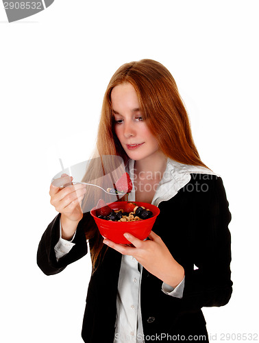 Image of Woman enjoying breakfast.