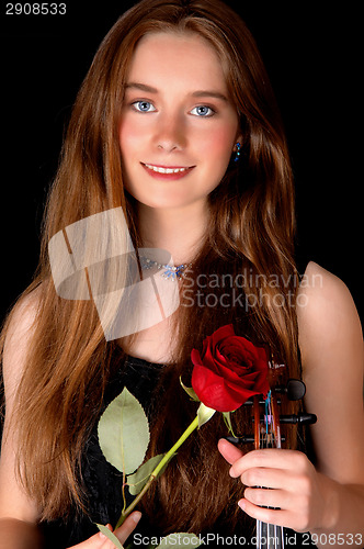 Image of Standing woman with rose.