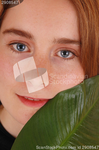 Image of Face of woman with leaf.