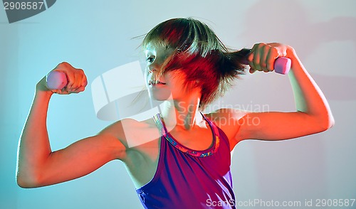 Image of child exercising with dumbells