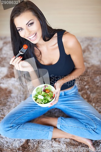 Image of Healthy beautiful woman eating fresh salad