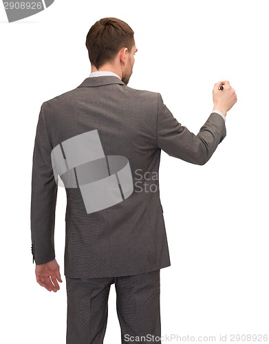 Image of businessman or teacher with marker from back
