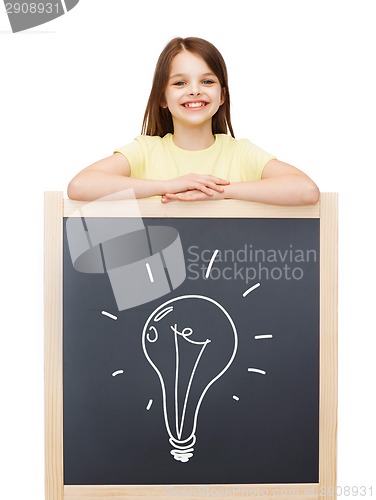 Image of happy little girl with blackboard