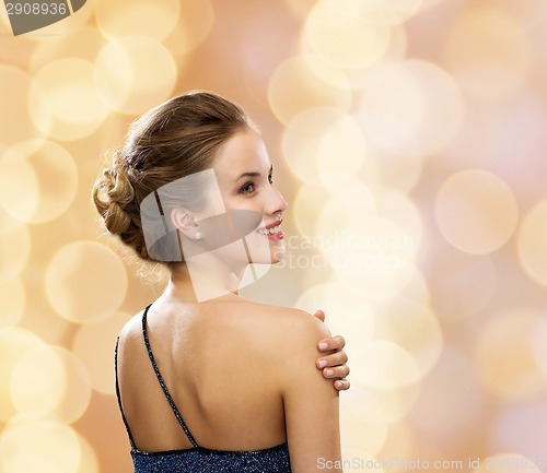 Image of smiling woman in evening dress