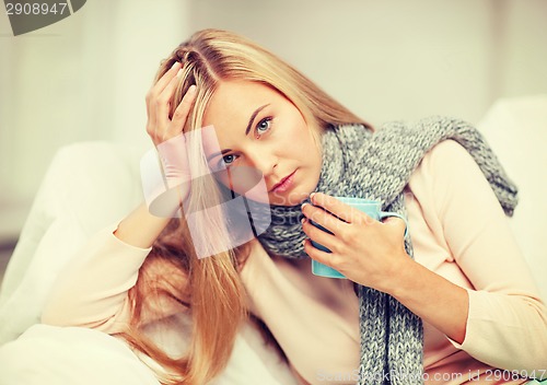 Image of diseased woman with cup of tea