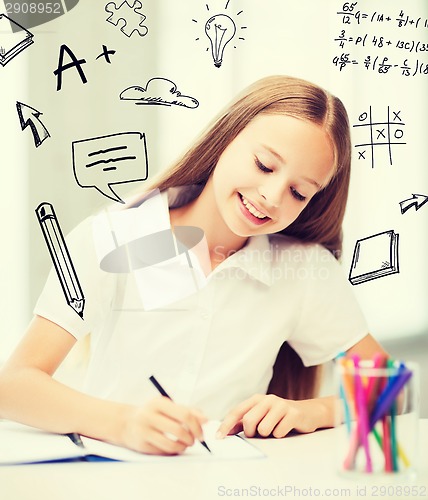 Image of little student girl drawing at school