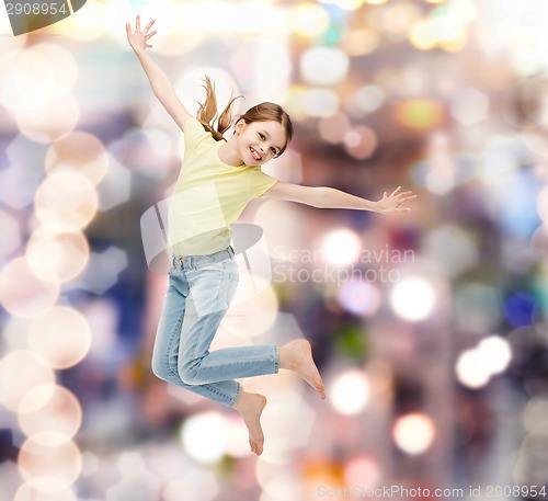 Image of smiling little girl jumping