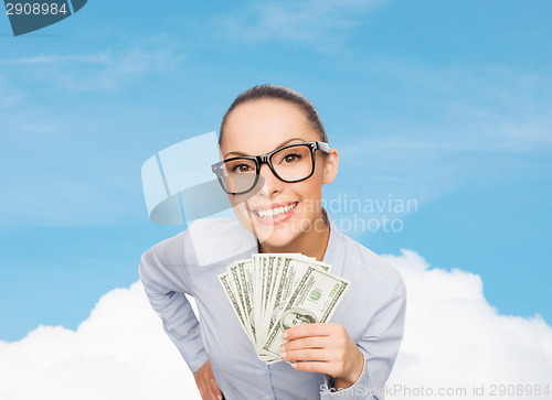 Image of smiling businesswoman with dollar cash money