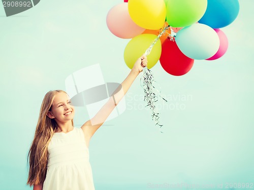 Image of happy girl with colorful balloons