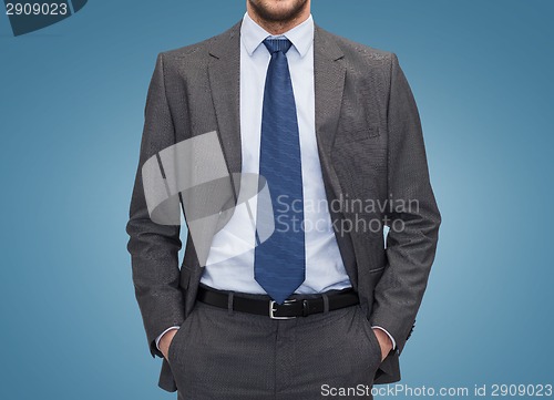 Image of close up of businessman over blue background