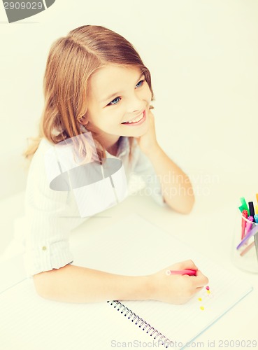 Image of little student girl drawing at school