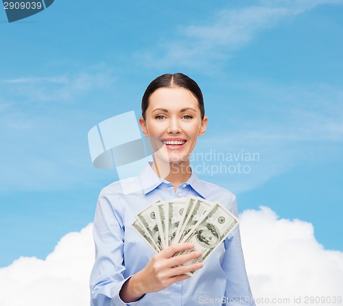 Image of businesswoman with dollar cash money