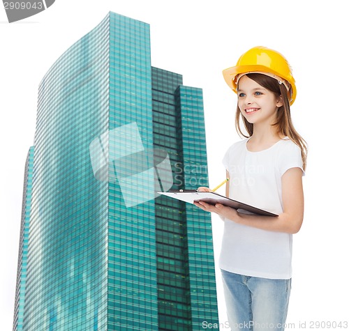 Image of smiling little girl in hardhat with clipboard