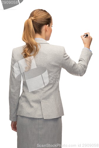 Image of businesswoman or teacher with marker from back