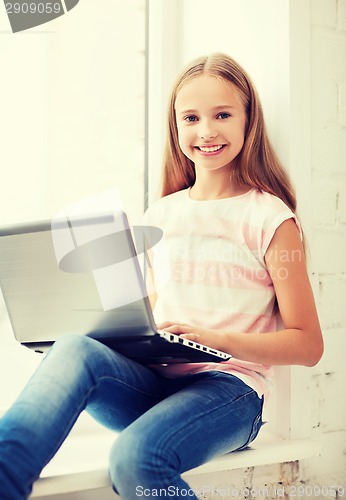 Image of girl with laptop pc at school