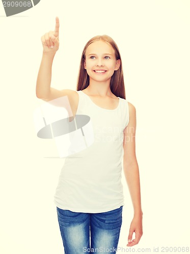 Image of girl in blank white shirt pointing to something