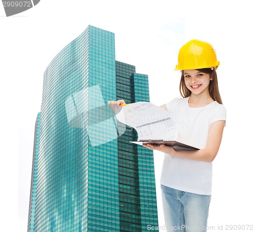 Image of smiling little girl in hardhat with clipboard