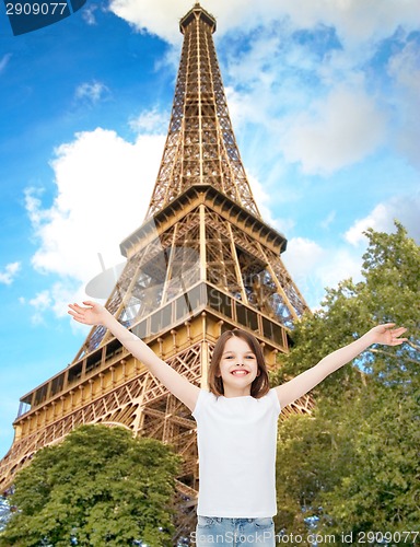 Image of smiling teenage girl with raised hands