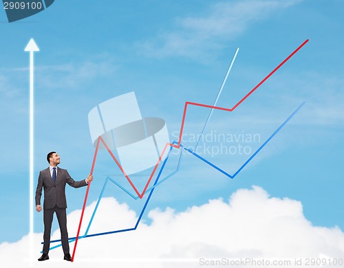 Image of smiling man holding graph line