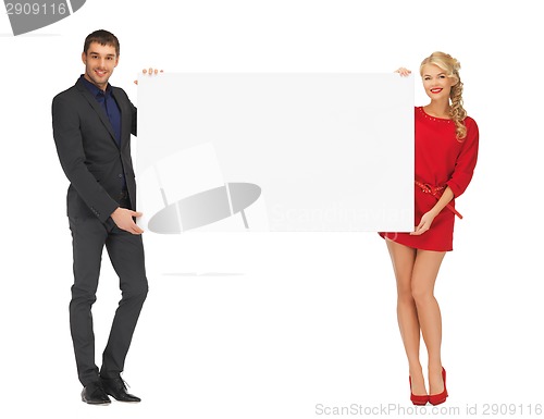 Image of couple holding big blank white board