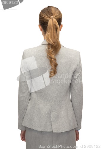 Image of businesswoman or teacher in suit from back