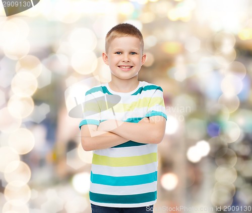 Image of little boy in casual clothes with arms crossed