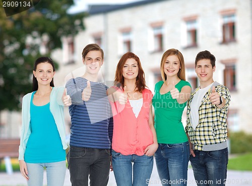 Image of group of smiling students showing thumbs up