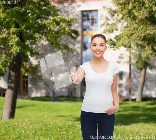 Image of smiling young woman in blank white t-shirt