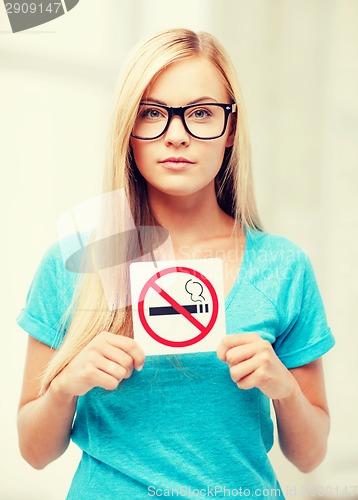 Image of woman with smoking restriction sign