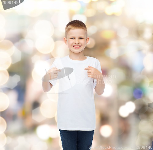 Image of smiling little boy in white blank t-shirt