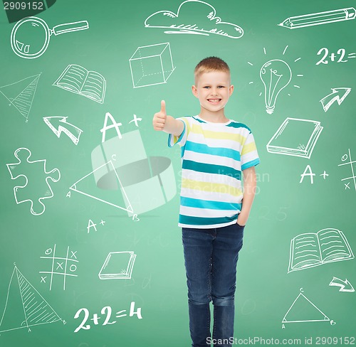 Image of little boy in casual clothes with arms crossed