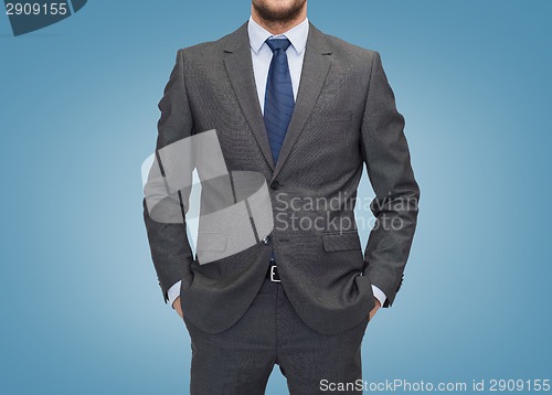 Image of close up of businessman over blue background