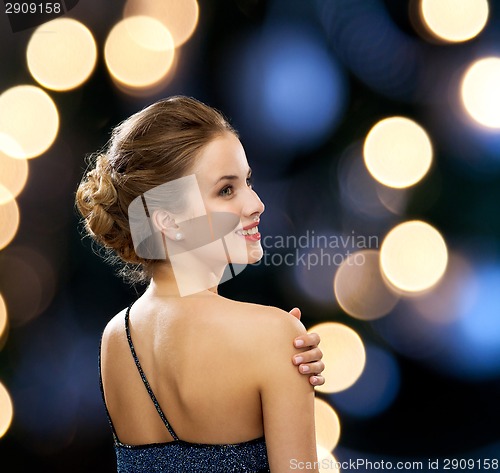 Image of smiling woman in evening dress