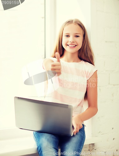 Image of girl with laptop pc at school